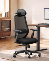 Black ProtoArc EC200 chair at a desk · ergoliv